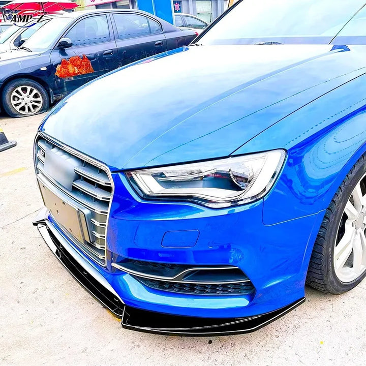 Close-up of the gloss black finish on an Audi 8V front splitter