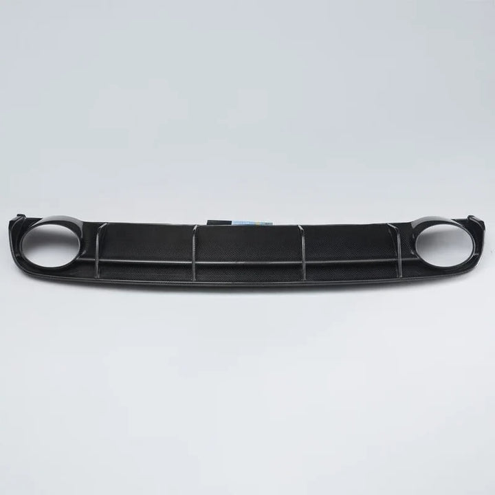 Carbon fibre rear diffuser for Audi RS6 C7 on a plain background