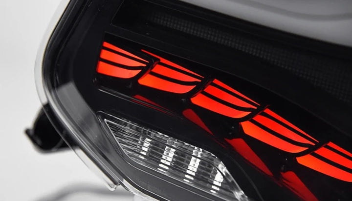 OLED plug and play rear tail lights for BMW 2 Series M2 on a plain background close up