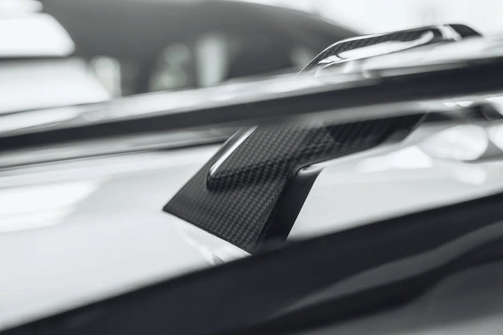Dry carbon fibre wing spoiler for BMW F30 showing weave