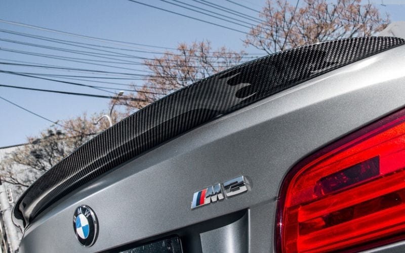 Carbon fibre rear boot spoiler for BMW E93 showing 2x2 twill weave and gloss finish