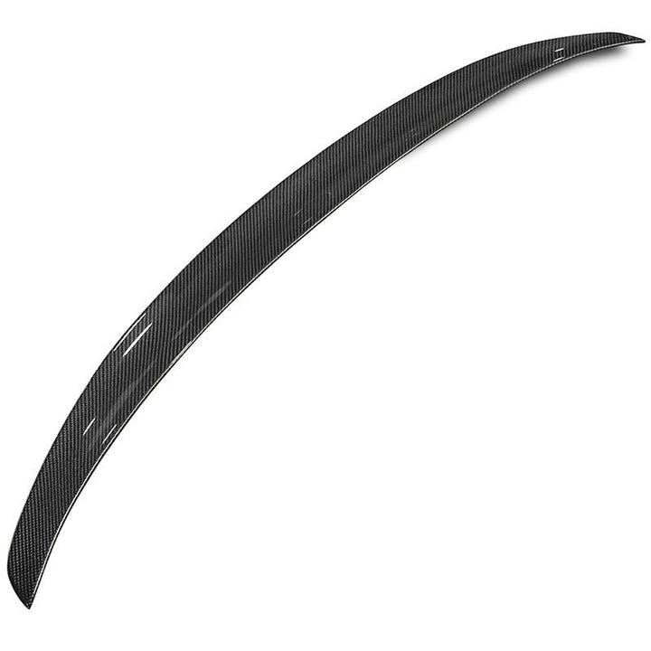 Pre-preg carbon fibre rear spoiler for BMW 4 Series on a plain background