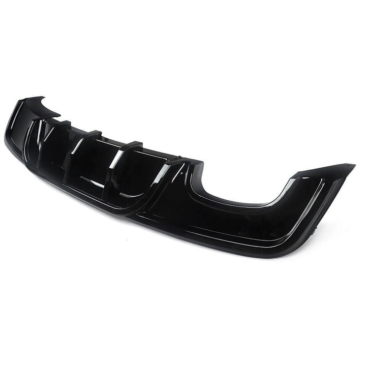Gloss black rear diffuser for BMW E82 M Sport showing left exhaust cut-out