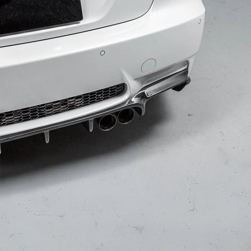 Carbon fibre weave detail on BMW M3 rear diffuser showing left exhausts