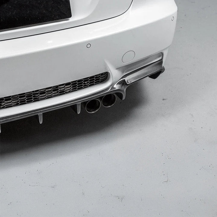 Carbon fibre weave detail on BMW M3 rear diffuser showing left exhausts