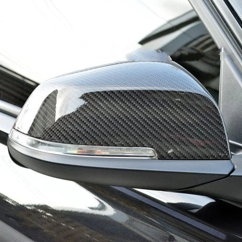 BMW F32 4 Series with an OEM style carbon fibre mirror cover, close-up