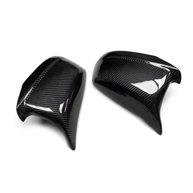 Carbon fibre mirror cover for BMW F10 5 Series showing weave
