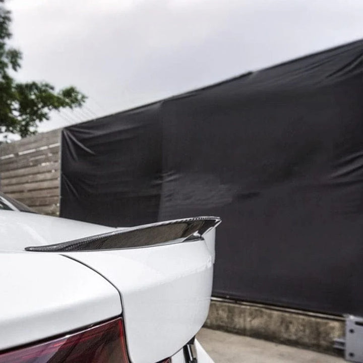 Carbon fibre rear boot spoiler V2 for BMW M2 F87 showing weave and gloss finish