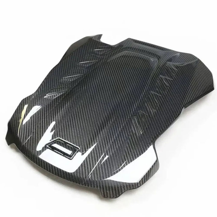 Dry carbon fibre engine cover for BMW X5M F95 showing weave
