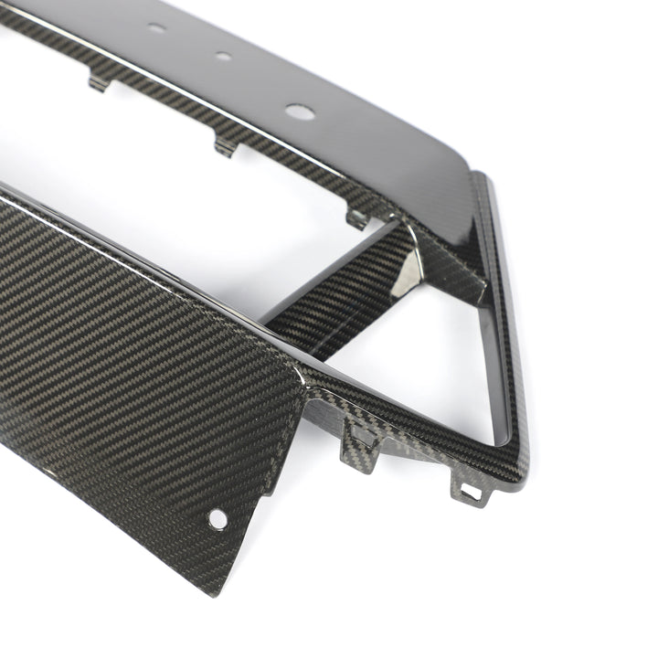 Dry carbon fibre lower grille trim for BMW X5M F95 showing weave