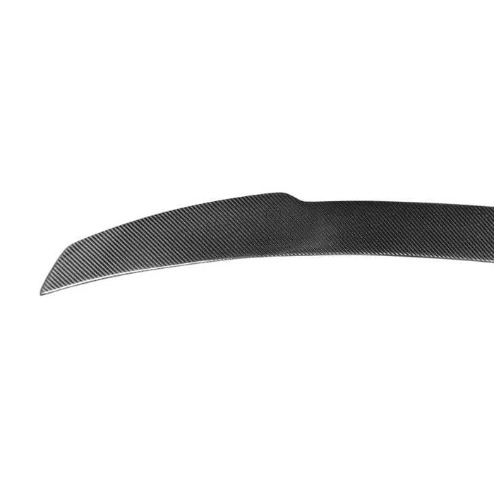 BMW X5M F95 carbon fibre rear spoiler close-up showing weave