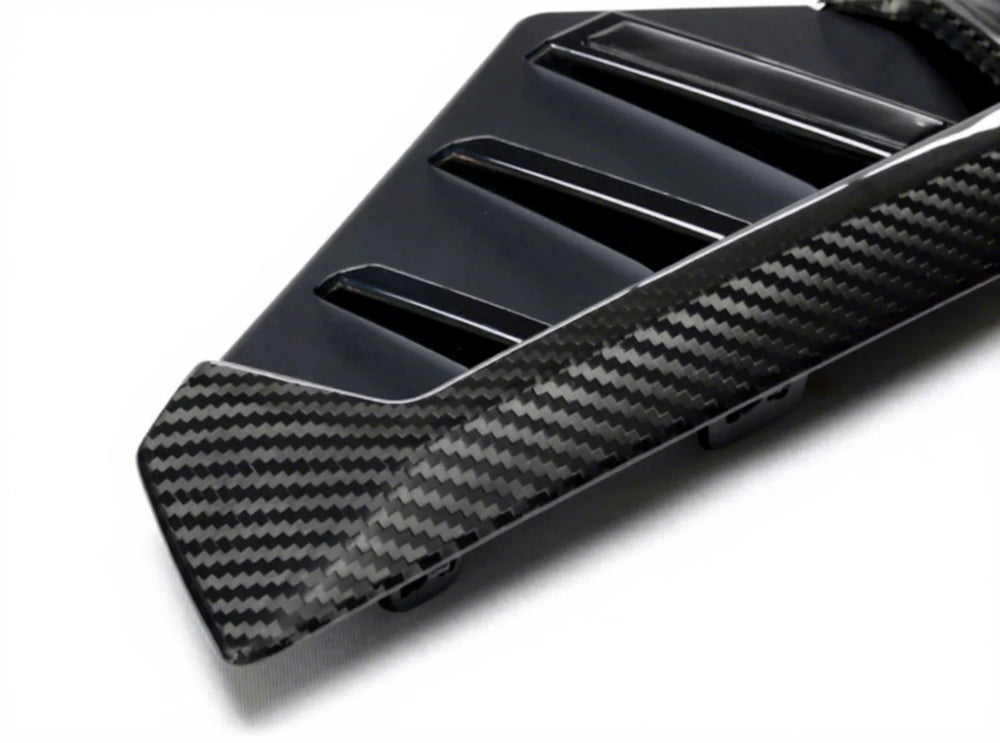 Dry carbon fibre side fender trim for BMW X5M F95 showing weave