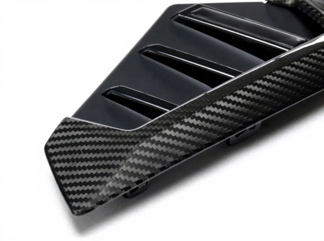 Dry carbon fibre side fender trim for BMW X5M F95 showing weave