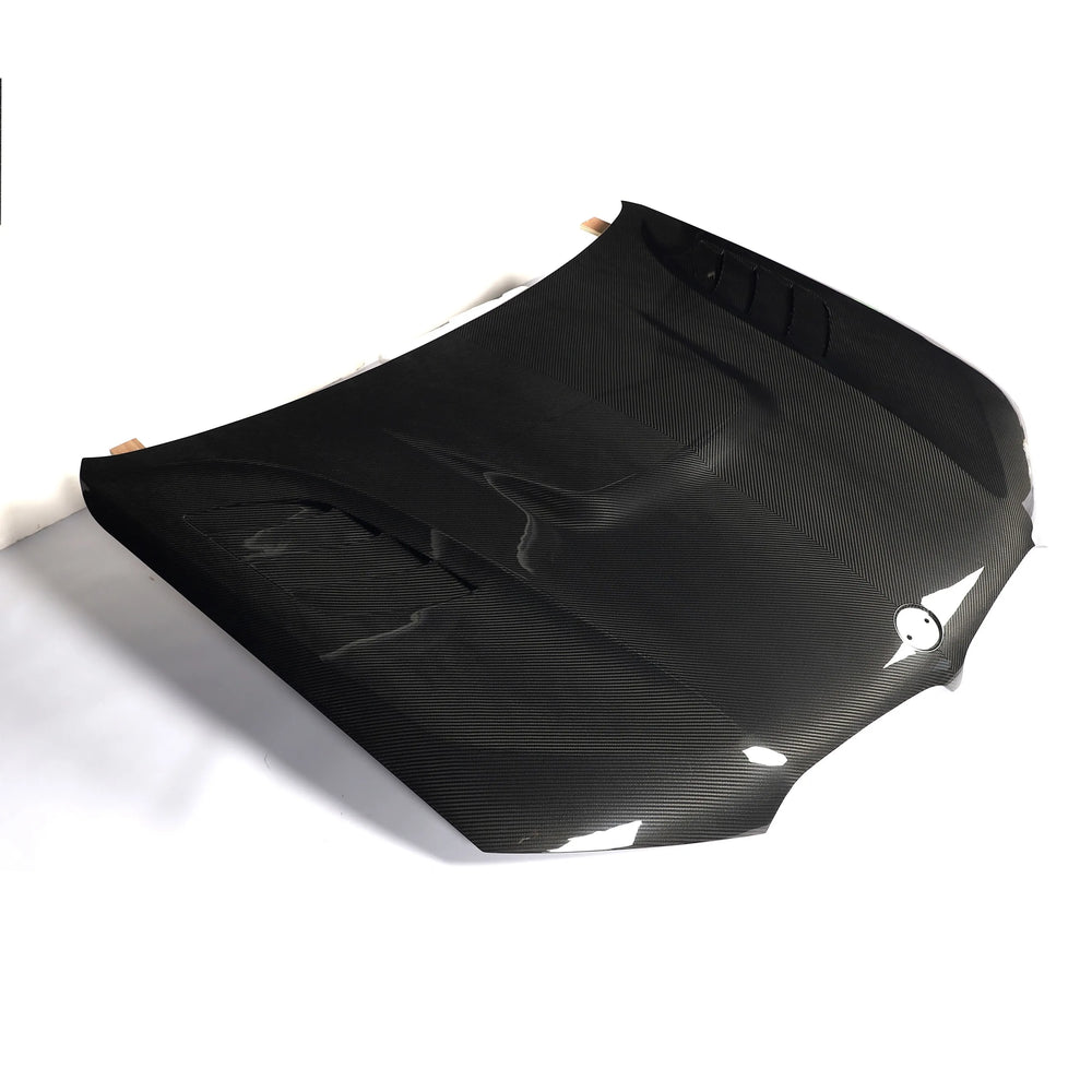 Dry carbon fibre bonnet for BMW X5M F95 showing weave
