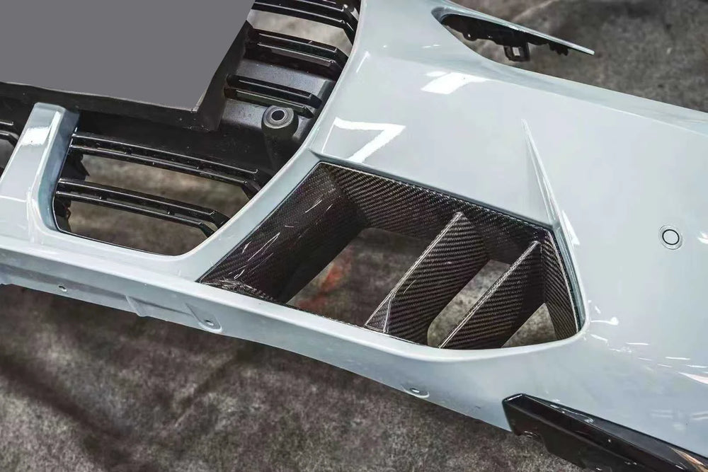 BMW M4 G82 dry carbon fibre front bumper duct installed close-up