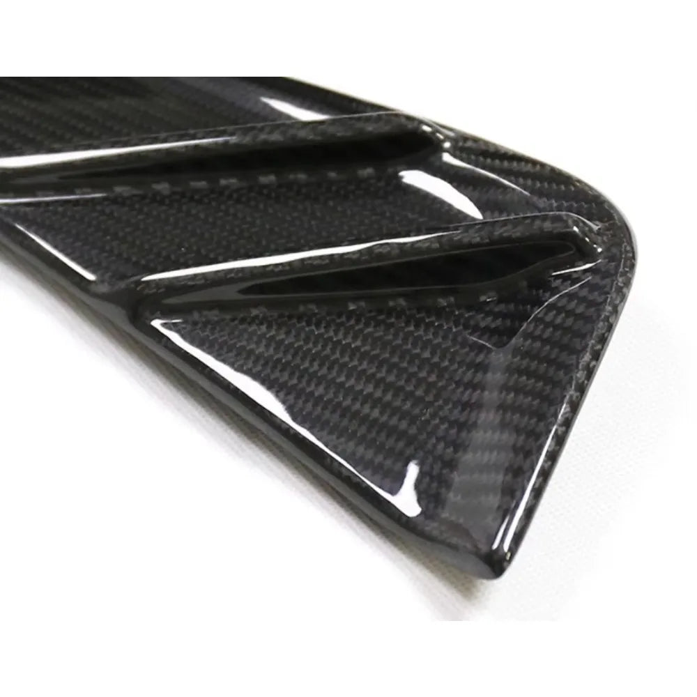 Dry carbon fibre fender trim for BMW M3 G80 showing weave