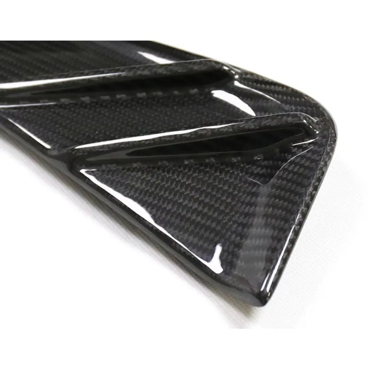 Dry carbon fibre fender trim for BMW M3 G80 showing weave