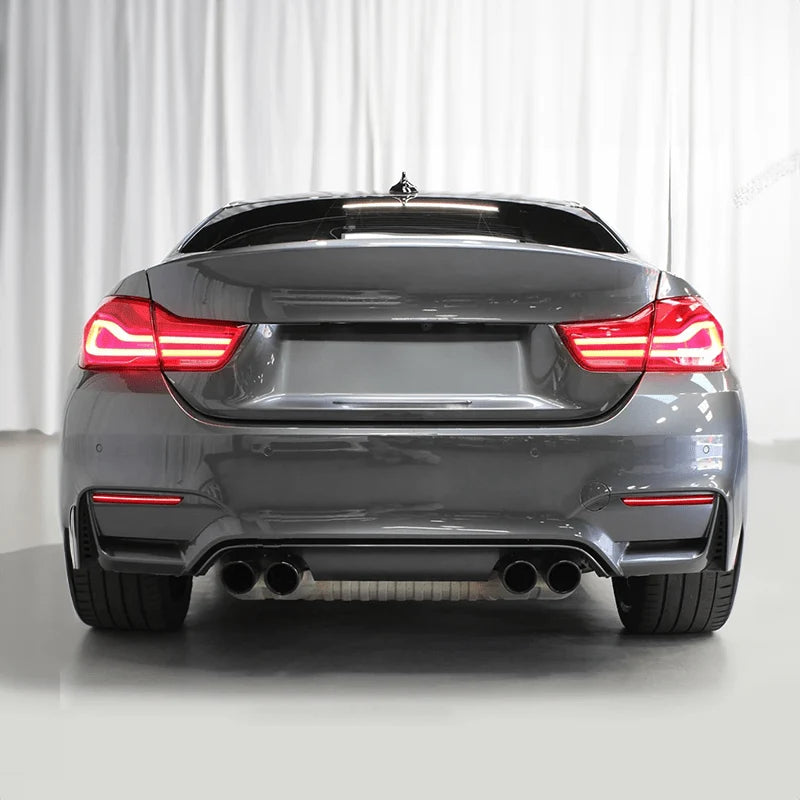 OEM red LED rear bumper lower reflector for BMW M4 F82, close-up of the lens