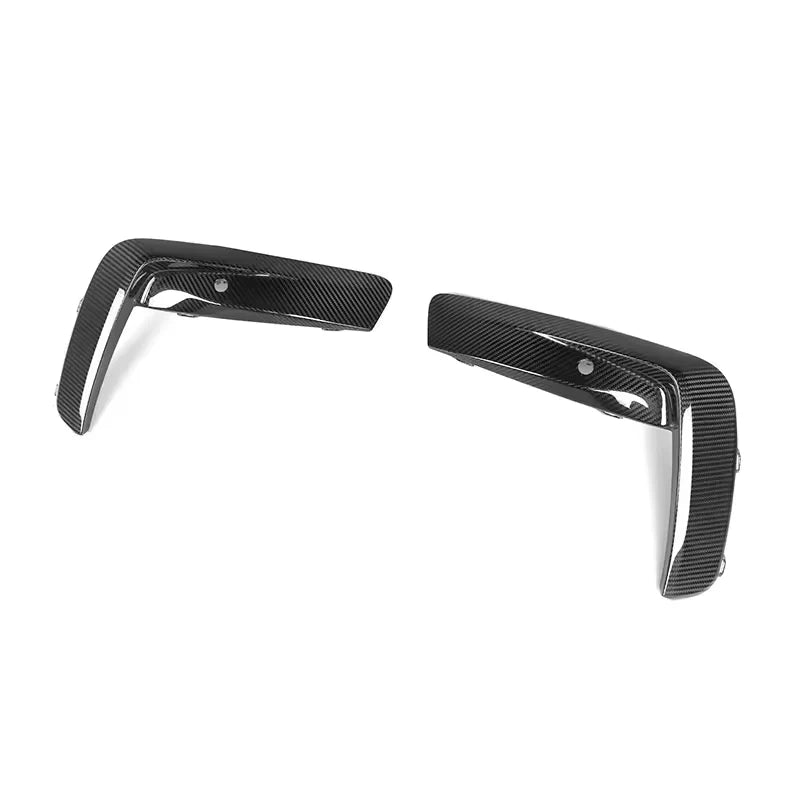V1 dry carbon fibre front bumper upper trims for BMW M8 F91 F92 F93 on a plain background angle shot