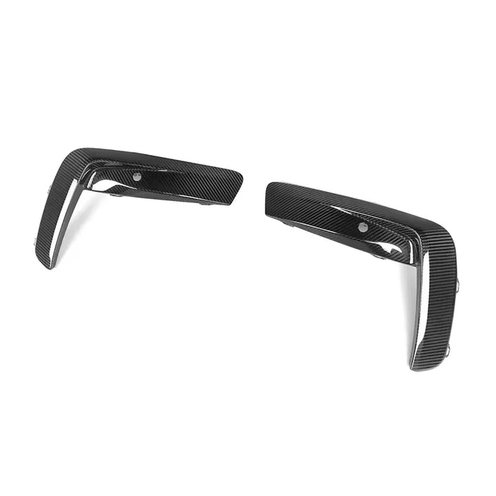 V1 dry carbon fibre front bumper upper trims for BMW M8 F91 F92 F93 on a plain background angle shot