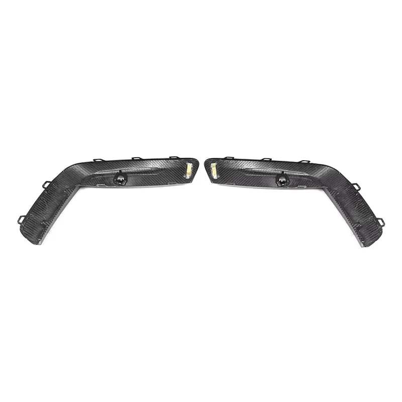 V1 dry carbon fibre front bumper upper trims for BMW M8 F91 F92 F93 on a plain background showing clips and mounting points