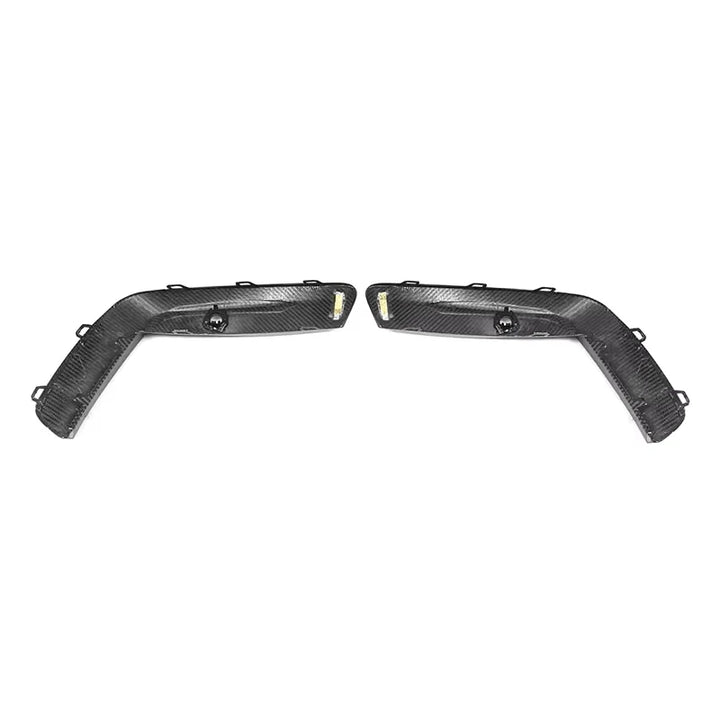 V1 dry carbon fibre front bumper upper trims for BMW M8 F91 F92 F93 on a plain background showing clips and mounting points
