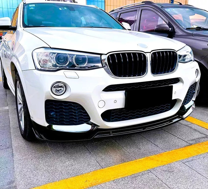 Gloss black front splitter fitted to a BMW X3 F25 M Sport, front three-quarter view