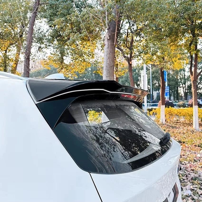 Gloss black rear roof spoiler fitted to a BMW X3 G01, rear three-quarter view