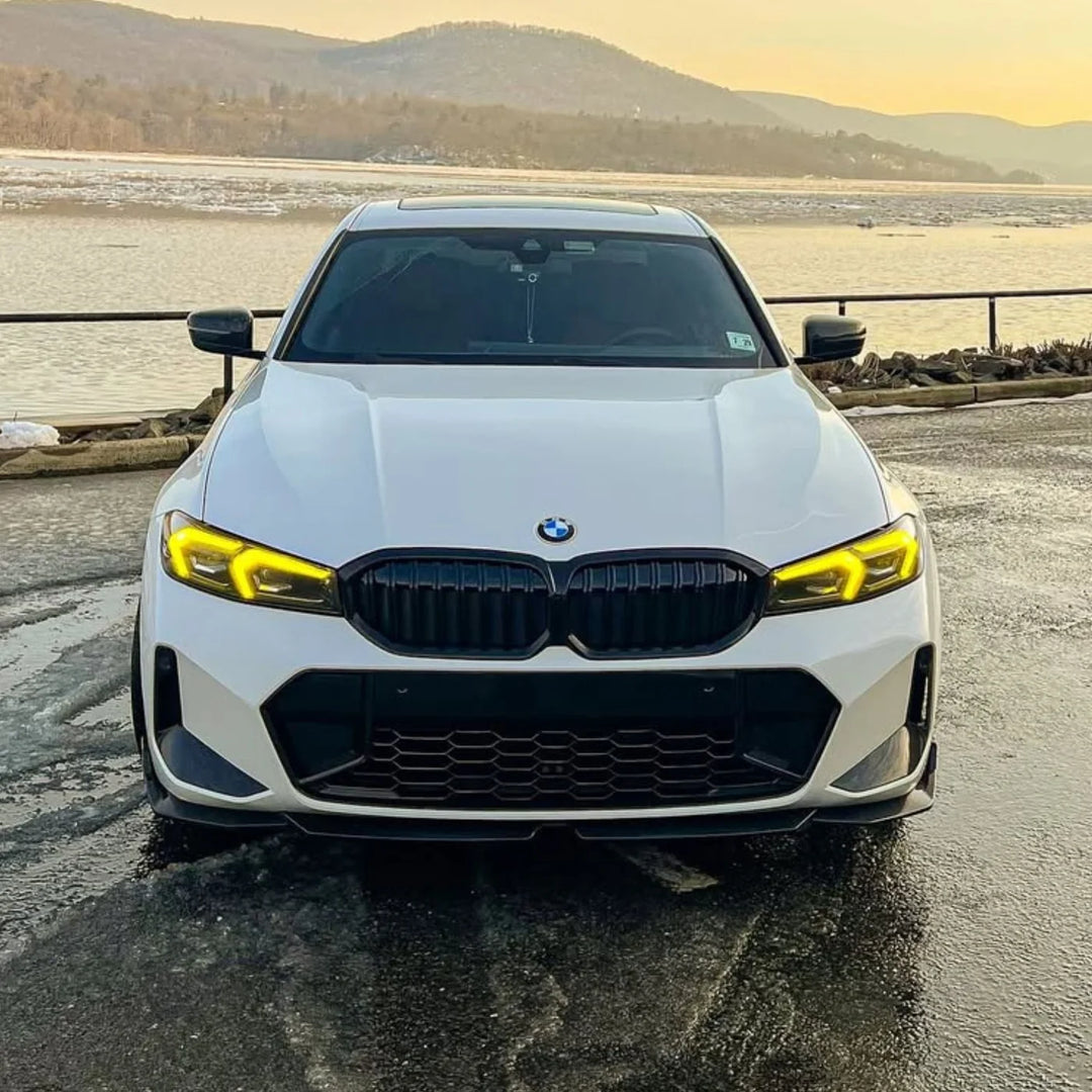 Front of a BMW G20 3 Series with yellow daytime running lights installed