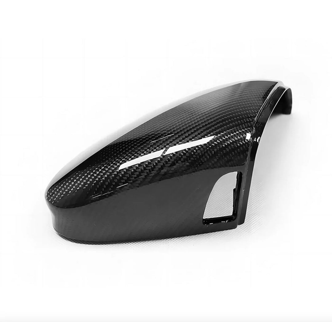 Golf MK8 carbon fibre mirror covers pair showing lane assist hole cutout