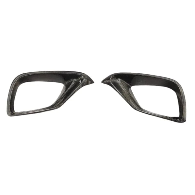 Pre-preg carbon fibre front fog covers for Mercedes E63 W213 on a plain background