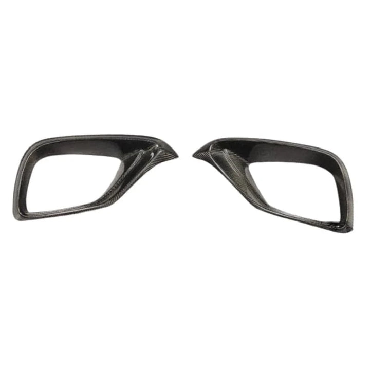 Pre-preg carbon fibre front fog covers for Mercedes E63 W213 on a plain background