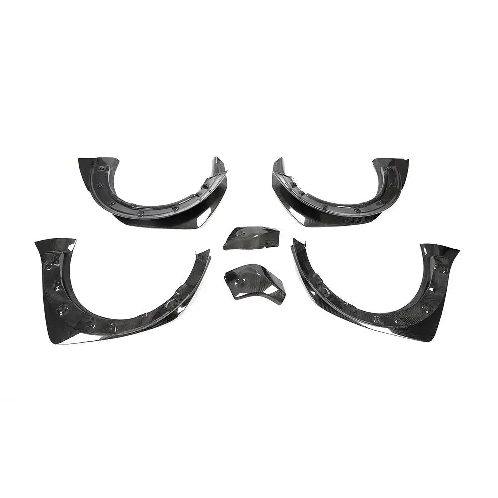 Carbon fibre fender flares for MINI Cooper S F56 on a plain background showing rear side