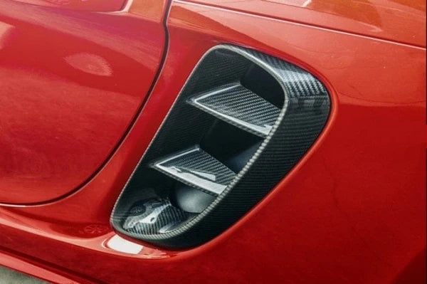 Dry carbon fibre vent trim for Porsche 718 Cayman showing weave