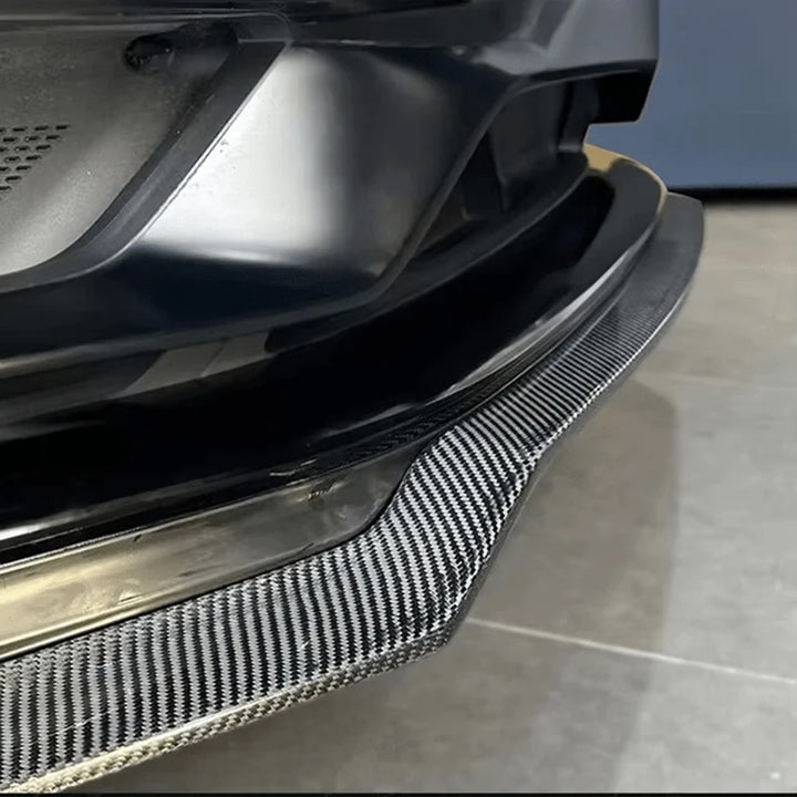 Porsche 718 Boxster GTS front splitter close-up showing weave