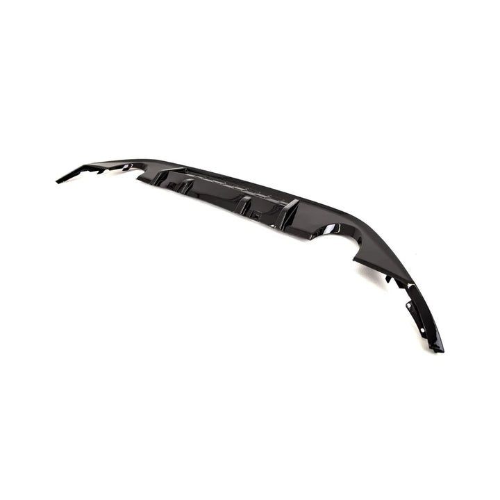 Gloss black ABS rear diffuser for Golf Mk7.5 on a plain background angle view