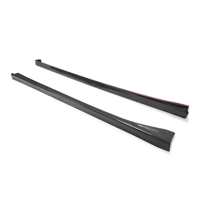 Pair of 2x2 twill carbon fibre side skirts for Toyota GT86 on a plain background